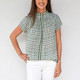 Sage Watercolor Floral 

This elevated staple with its sporty contrast stripe is already a customer favorite! Pair this season's gorgeous new colorways with everything from white jeans, a blazer tor an open cardigan. The blouse can also be worn off the shoulder for a stunning evening look. We recommend sizing down in this style.