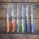 Practical art for your kitchen, this Six Piece Steak Knives set will be the talk of the dinner party! New West KnifeWorks is known for their superb quality and eye-catching design and now they have reinvented the average steak knife. Their expertly crafted knives boast the highest performing knife steel on the market paired with an aerospace-grade fiberglass epoxy handle, making them beautiful and functional.

